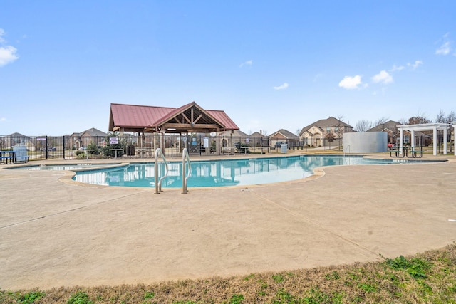 view of swimming pool with a pergola and a patio