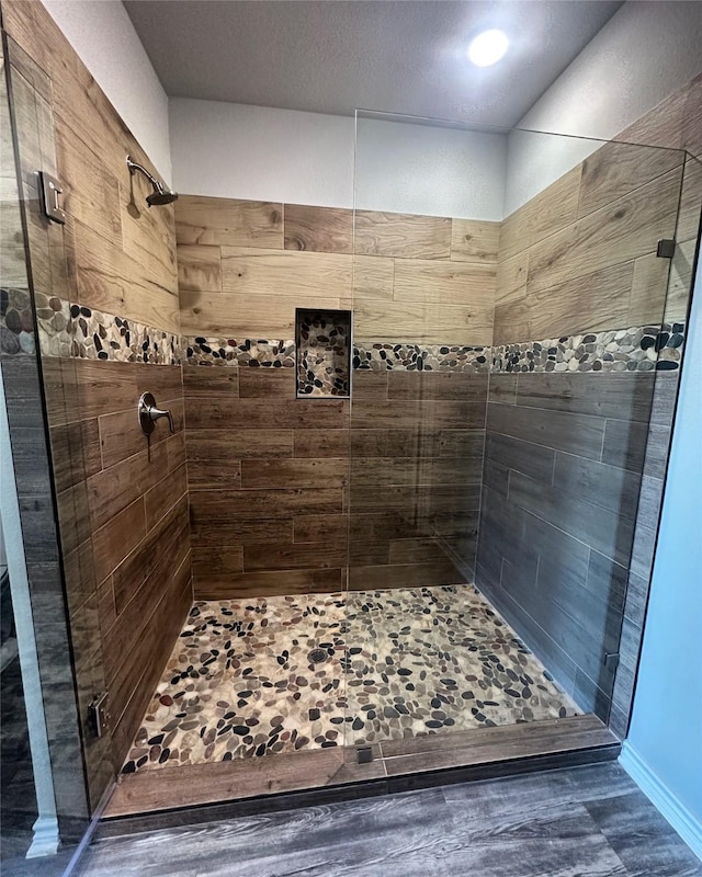 bathroom with a shower with shower door