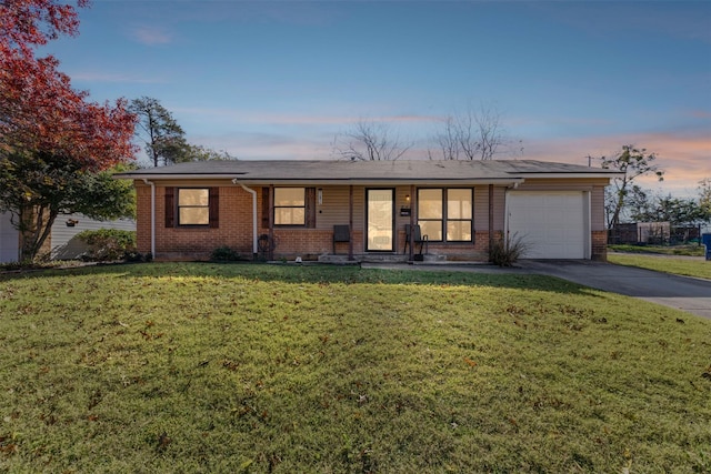 ranch-style house with a lawn and a garage