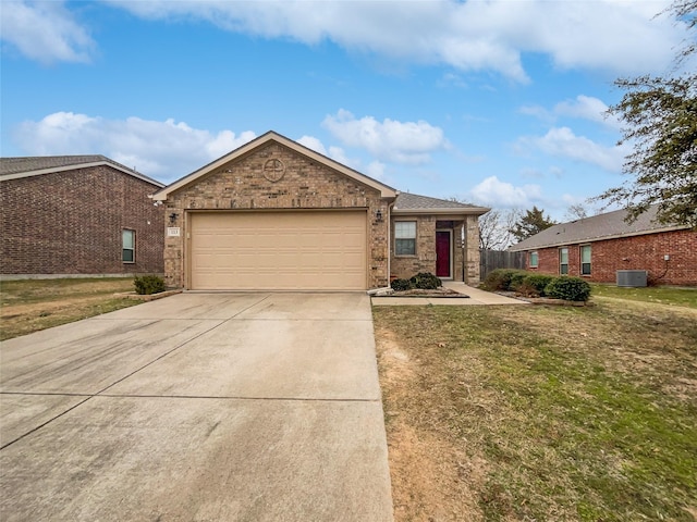 single story home with a garage, a front yard, and central air condition unit