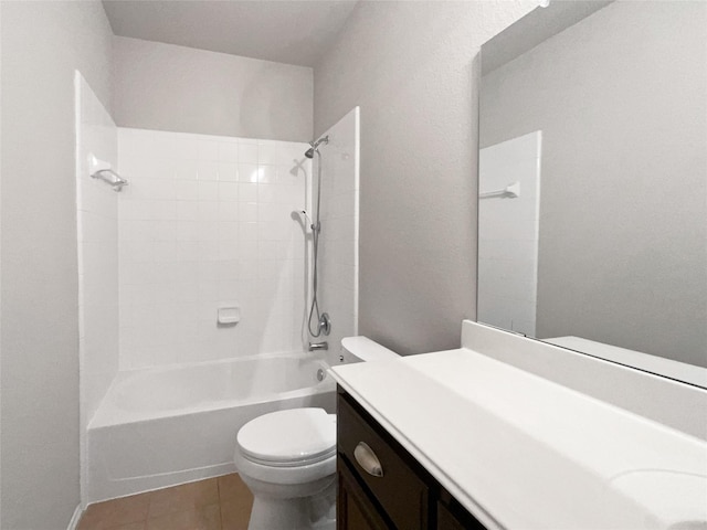 full bathroom with vanity, toilet, tiled shower / bath combo, and tile patterned flooring