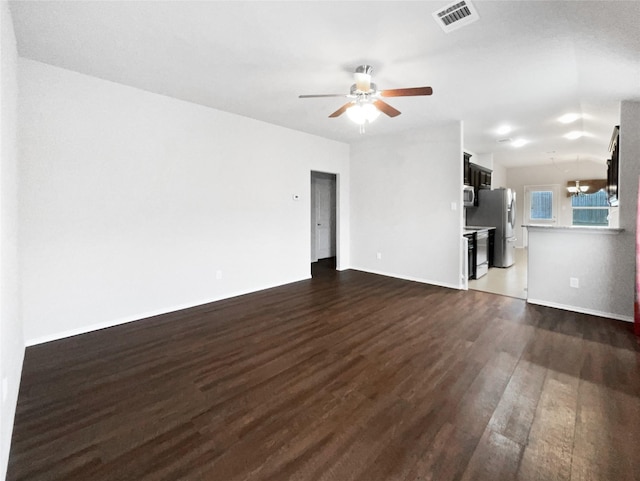 unfurnished living room with ceiling fan and dark hardwood / wood-style flooring