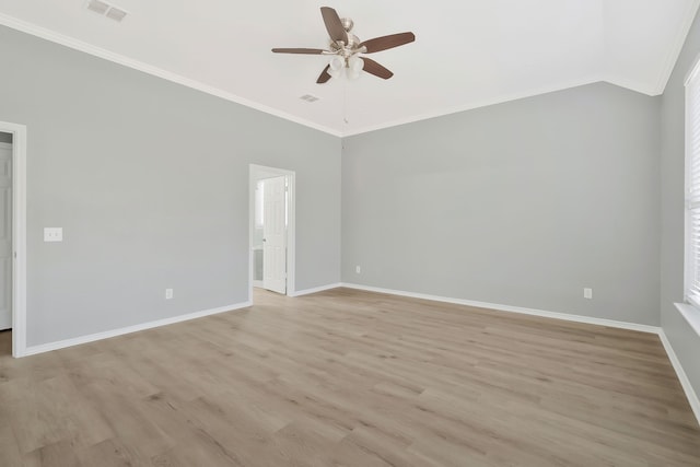 unfurnished room with crown molding, ceiling fan, lofted ceiling, and light wood-type flooring