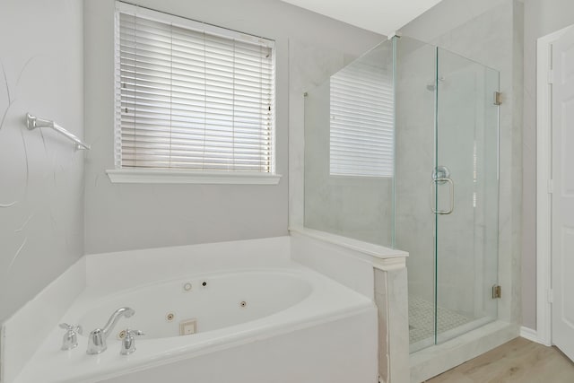 bathroom with shower with separate bathtub