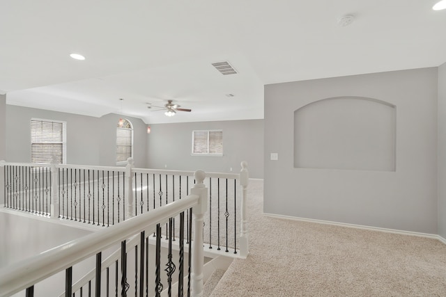 hallway with carpet floors