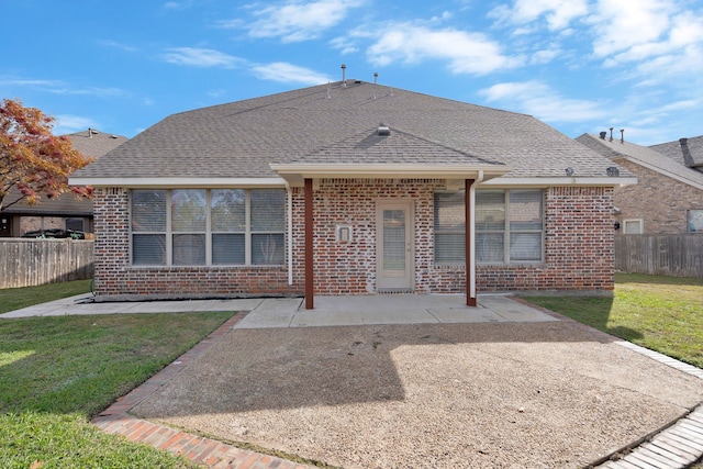 view of front facade with a patio and a front yard