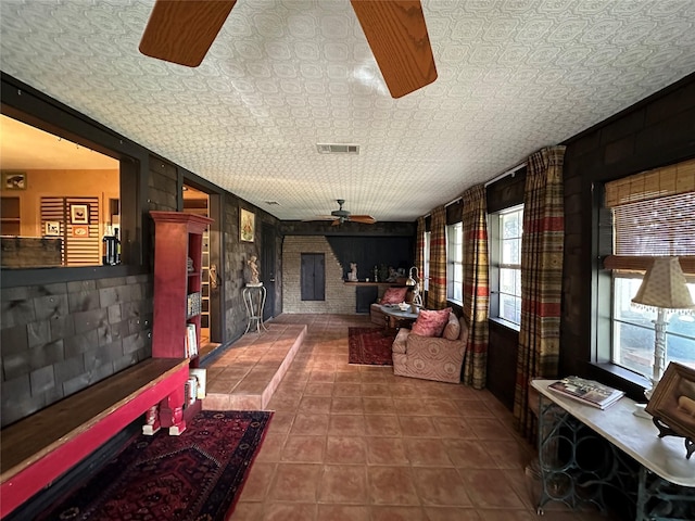 corridor with an ornate ceiling, visible vents, and tile patterned floors