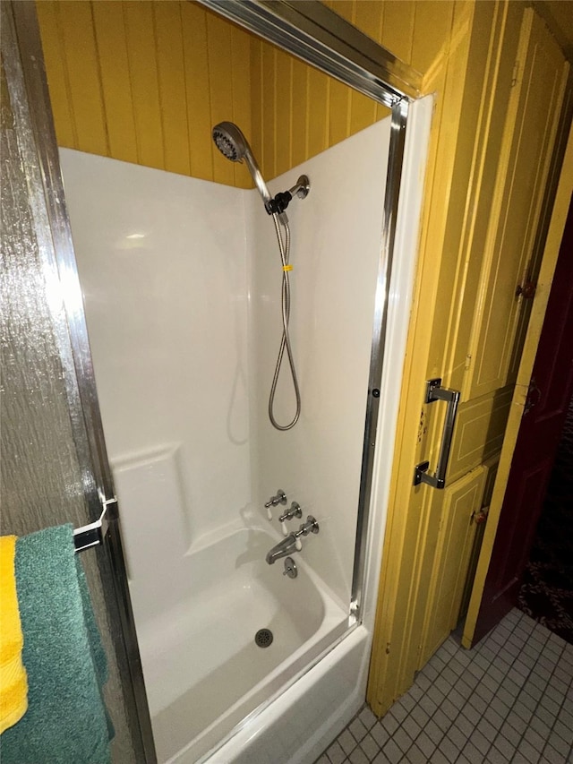 full bath featuring shower / bathing tub combination and tile patterned flooring