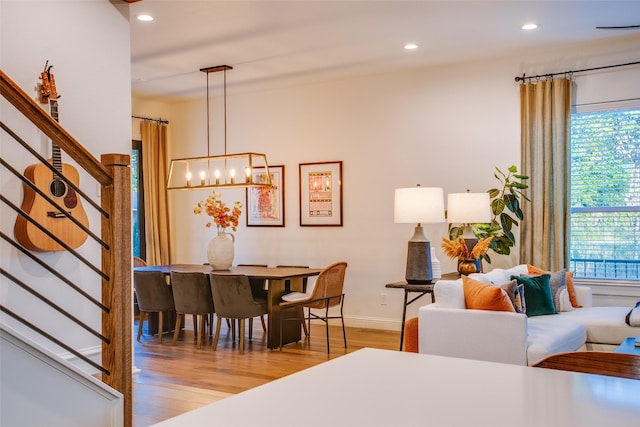 dining room with a chandelier and light hardwood / wood-style floors