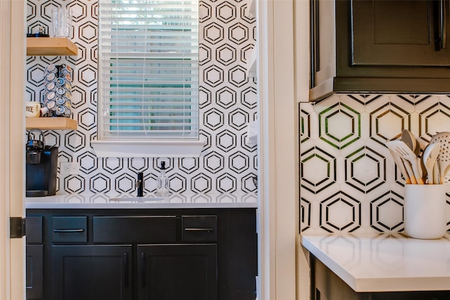 interior space featuring decorative backsplash and sink