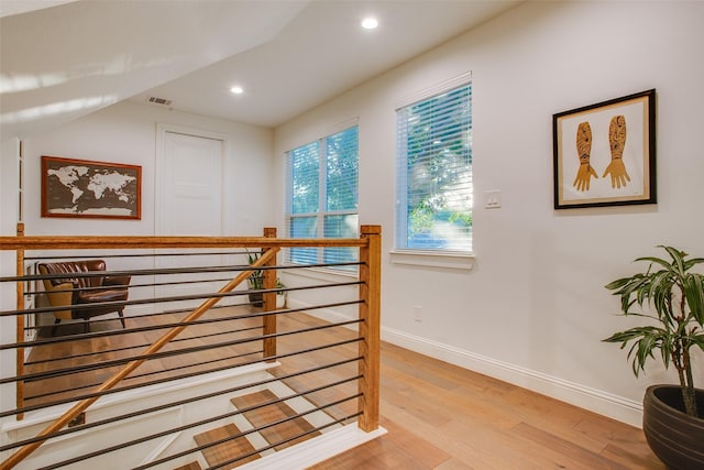 stairs featuring hardwood / wood-style floors