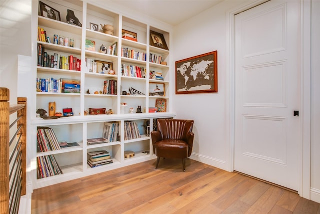 sitting room featuring light hardwood / wood-style floors