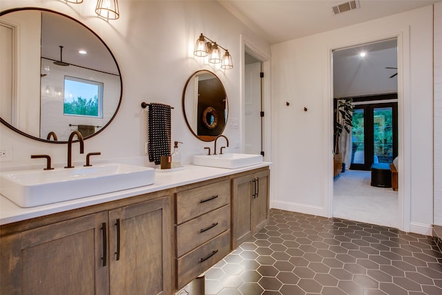 bathroom featuring tile patterned flooring and vanity