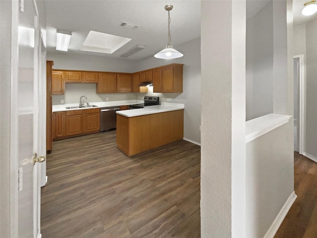 kitchen featuring pendant lighting, dark wood-type flooring, sink, and stainless steel appliances