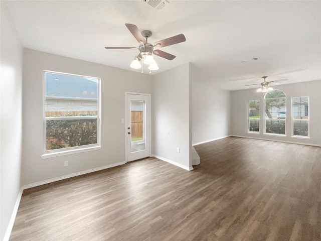 empty room featuring ceiling fan and dark hardwood / wood-style floors