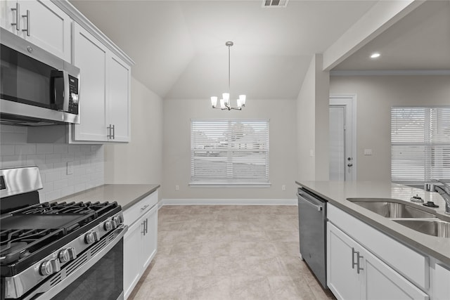 kitchen featuring white cabinetry, plenty of natural light, stainless steel appliances, and sink