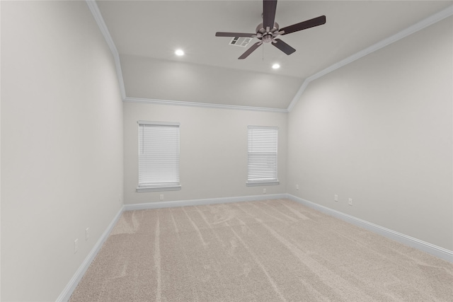 carpeted spare room featuring ornamental molding, ceiling fan, and lofted ceiling