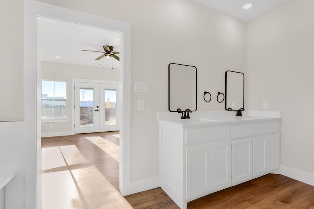 bathroom featuring vanity, hardwood / wood-style flooring, french doors, and ceiling fan