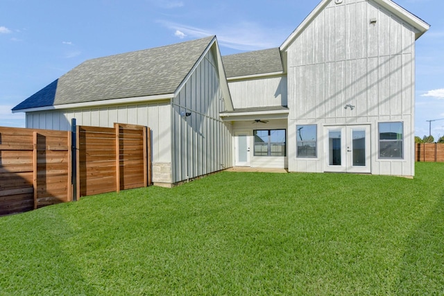 rear view of house with a lawn