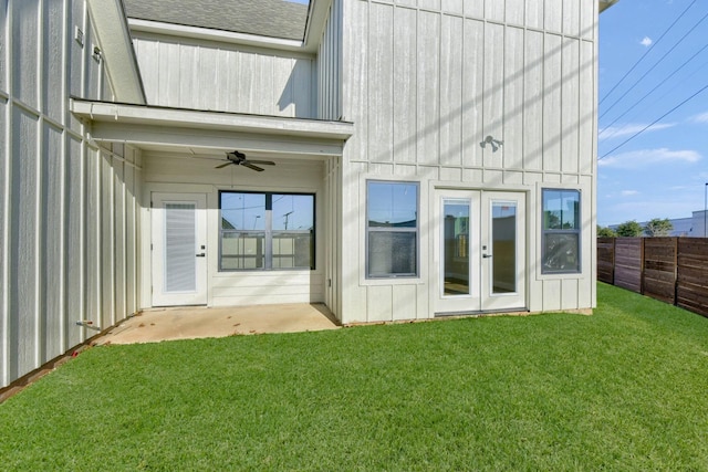 back of property with a patio, a lawn, french doors, and ceiling fan