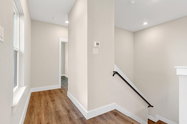 stairs featuring wood-type flooring