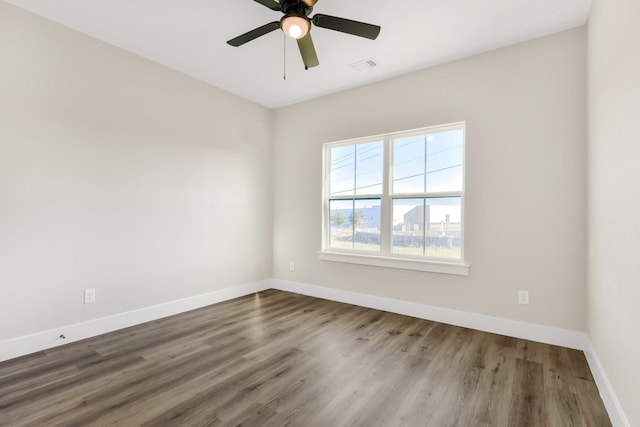 spare room with wood-type flooring and ceiling fan