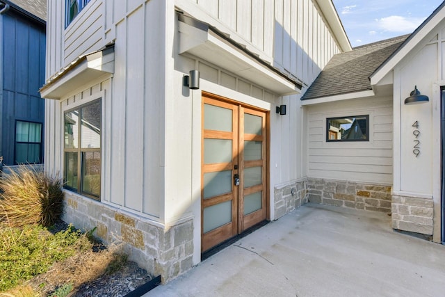 view of exterior entry featuring a patio area