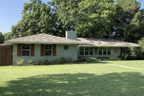 single story home featuring a front lawn