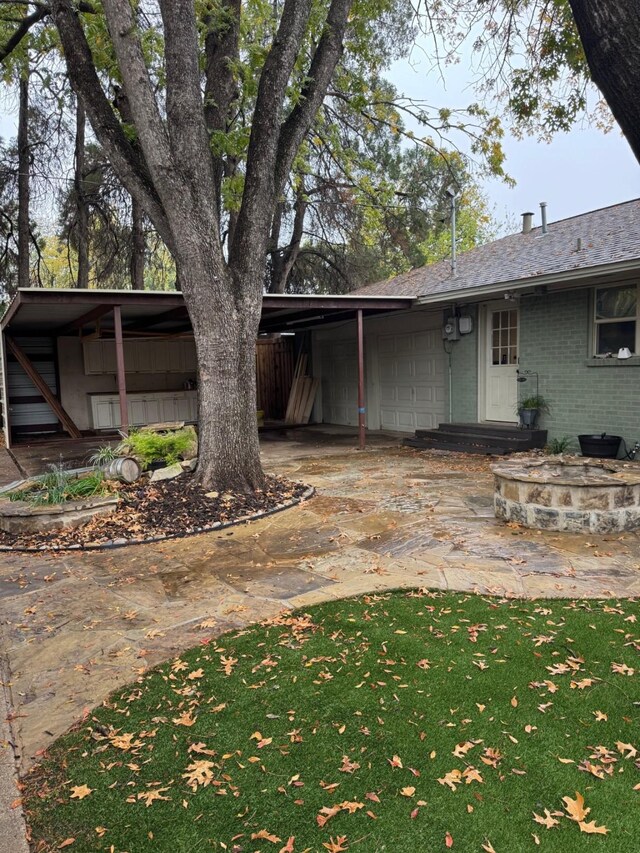 back of property featuring an outdoor fire pit