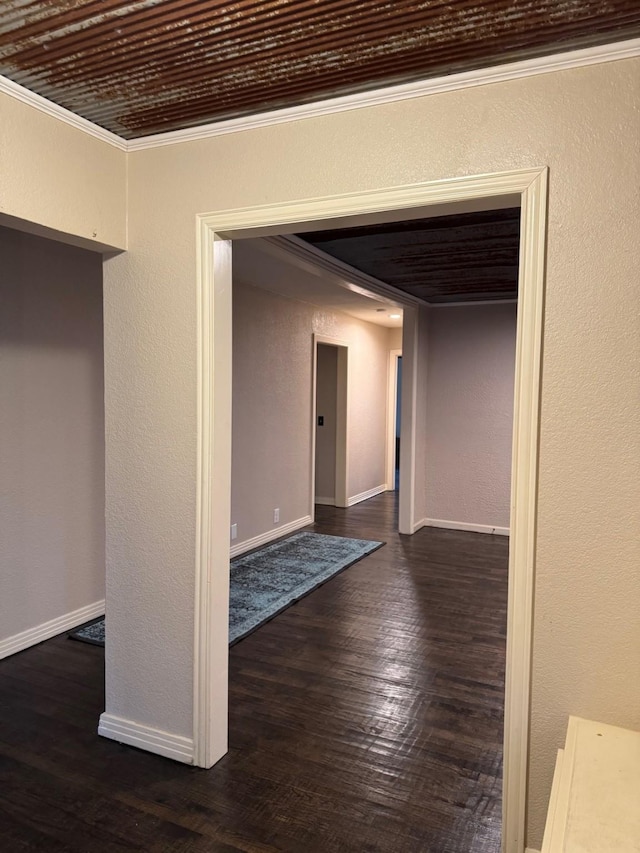 interior space featuring ornamental molding and dark wood-type flooring