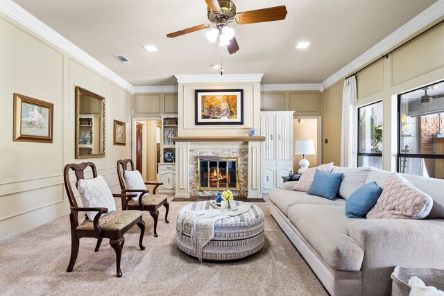 living room with light carpet, ceiling fan, and ornamental molding