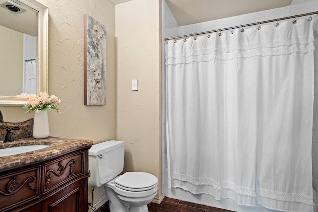 full bathroom featuring toilet, vanity, shower / bath combo, and hardwood / wood-style flooring