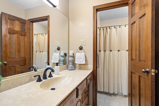 bathroom featuring tile patterned floors and vanity