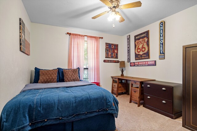 bedroom featuring ceiling fan and light colored carpet