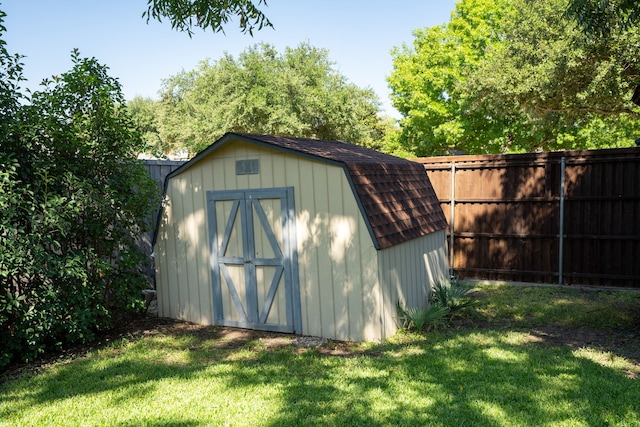 view of outdoor structure with a lawn