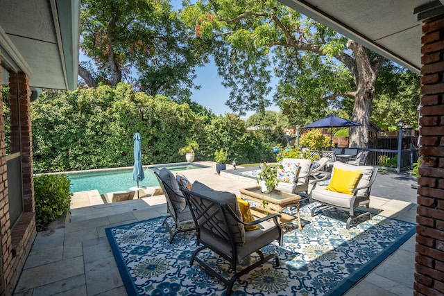 view of patio with a fenced in pool