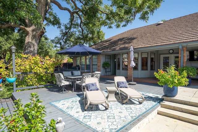 wooden deck featuring french doors