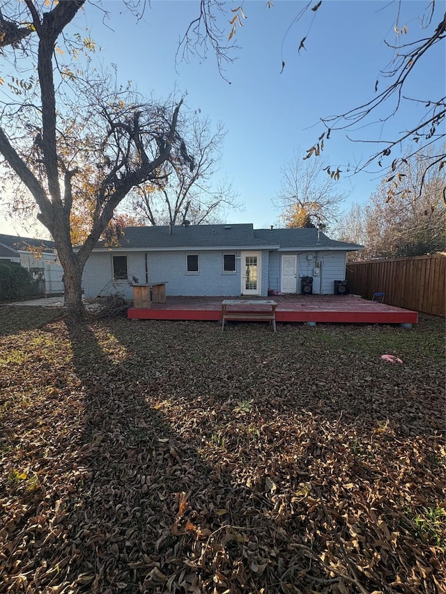 back of house featuring a deck