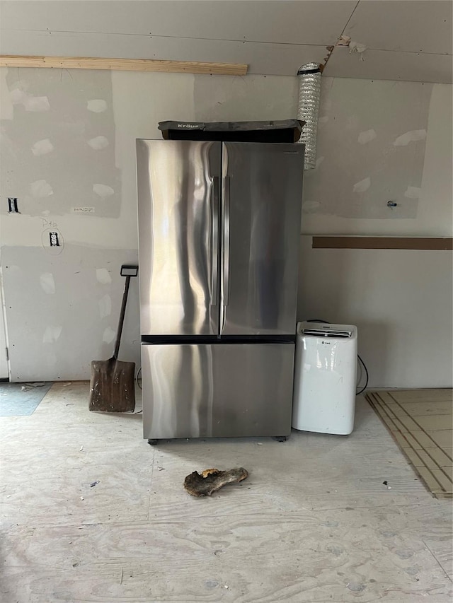 interior space featuring stainless steel refrigerator