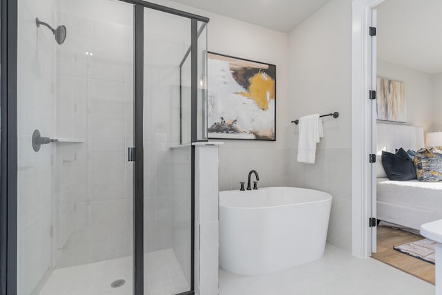 bathroom with plus walk in shower and tile walls