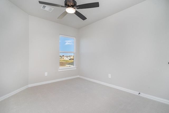 spare room featuring ceiling fan and carpet flooring