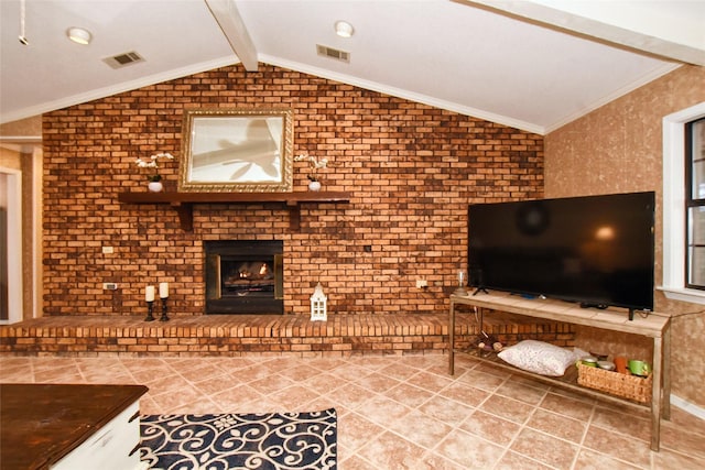 living room with vaulted ceiling with beams, crown molding, a fireplace, and brick wall