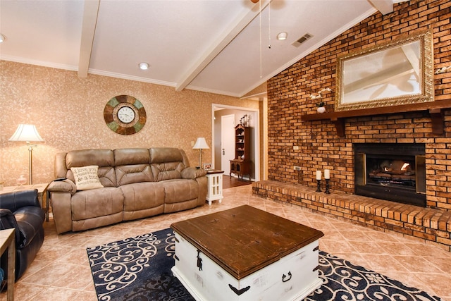 living room with light tile patterned floors, lofted ceiling with beams, a brick fireplace, and brick wall