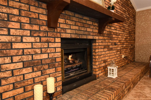 interior details featuring ornamental molding and a brick fireplace