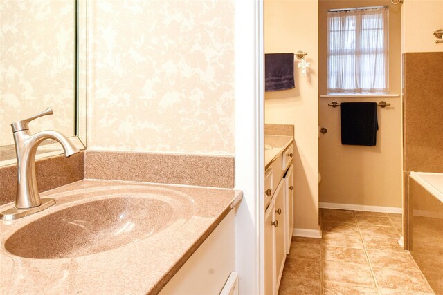 bathroom with vanity and a bathtub