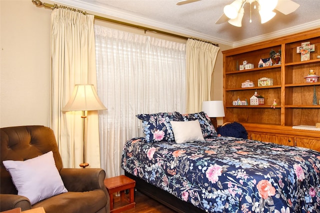 bedroom with a textured ceiling, dark hardwood / wood-style floors, ceiling fan, and crown molding