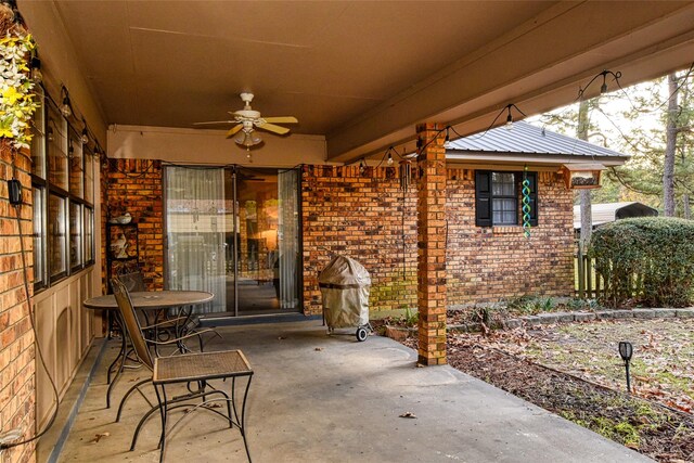 view of patio featuring ceiling fan and a grill