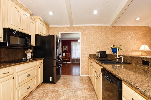 kitchen featuring black appliances, sink, dark stone countertops, and beamed ceiling