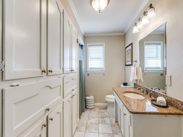 bathroom featuring crown molding, tile patterned flooring, vanity, and toilet