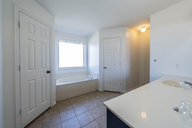 bathroom featuring a bath, vanity, and tile patterned floors